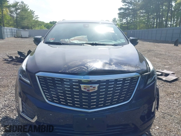 2021 Cadillac XT5 AWD Premium Luxury z VIN 1GYKNDRS8MZ217572, wystawiony jako IAAI lot #42190571 z przebiegiem 25 100 mil mil oraz . Historia ofert i sprzedaży dostępna na DreamBid. Obrazek 12.