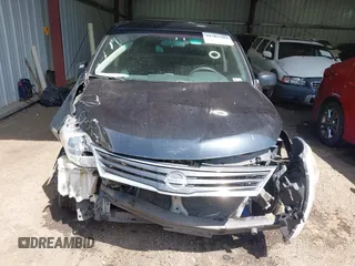 2011 Nissan Versa S z VIN 3N1BC1CP5BL500520, wystawiony jako IAAI lot #42307793 z przebiegiem 127 281 mil mil oraz . Historia ofert i sprzedaży dostępna na DreamBid. Obrazek 13.