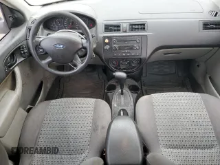 2007 Ford Focus S z VIN 1FAFP34N97W236303, wystawiony jako Copart lot #55248765 z przebiegiem 125 900 mil mil oraz Szkoda całkowita • Salvage title. Historia ofert i sprzedaży dostępna na DreamBid. Obrazek 8.