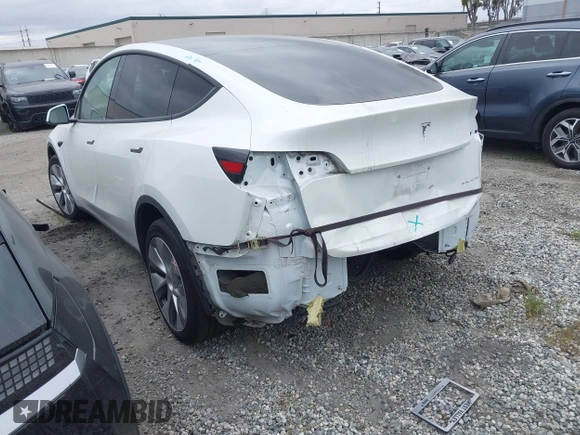 2023 Tesla Model Y Long Range z VIN 7SAYGDEE9PF623285, wystawiony jako IAAI lot #41383184 z przebiegiem 34 092 mil mil oraz . Historia ofert i sprzedaży dostępna na DreamBid. Obrazek 3.