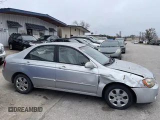 2004 Kia Spectra LX with VIN KNAFE121845043143, listed as a IAAI auction lot 41574523 with 211,758 mi miles. Bid and sale history available at carsss.com. Image 6.