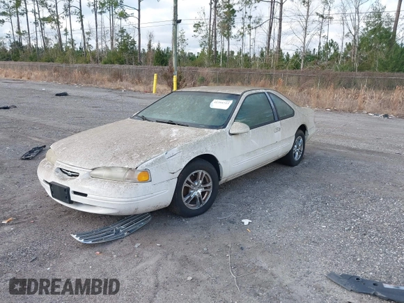 1996 Ford Thunderbird LX z VIN 1FALP62W4TH154400, wystawiony jako IAAI lot #41394723 z przebiegiem 65 860 mil mil oraz . Historia ofert i sprzedaży dostępna na DreamBid. Obrazek 2.