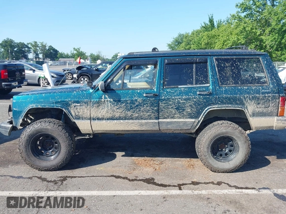 1995 Jeep Cherokee Sport z VIN 1J4FJ68S7SL623451, wystawiony jako IAAI lot #42581407 z przebiegiem 160 581 mil mil oraz . Historia ofert i sprzedaży dostępna na DreamBid. Obrazek 14.