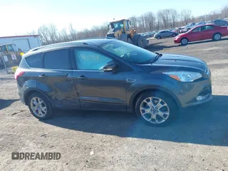 2015 Ford Escape Titanium with VIN 1FMCU9J9XFUB46843, listed as a IAAI auction lot 41800938 with 91,034 mi miles. Bid and sale history available at carsss.com. Image 13.