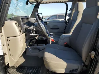 2004 Jeep Wrangler Sahara with VIN 1J4FA59S04P772756, listed as a Copart auction lot 47973495 with 92,685 mi miles and Salvage Title. Bid and sale history available at DreamBid. Image 7.