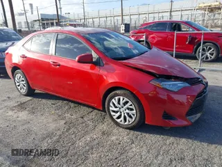 2018 Toyota Corolla L z VIN 5YFBURHE8JP756975, wystawiony jako IAAI lot #41700996 z przebiegiem 168 524 mil mil oraz . Historia ofert i sprzedaży dostępna na DreamBid. Obrazek 1.