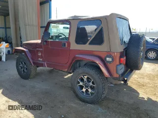 2002 Jeep Wrangler Sahara with VIN 1J4FA59S92P708647, listed as a Copart auction lot 74851654 with 131,794 mi miles and Salvage Title. Bid and sale history available at carsss.com. Image 2.