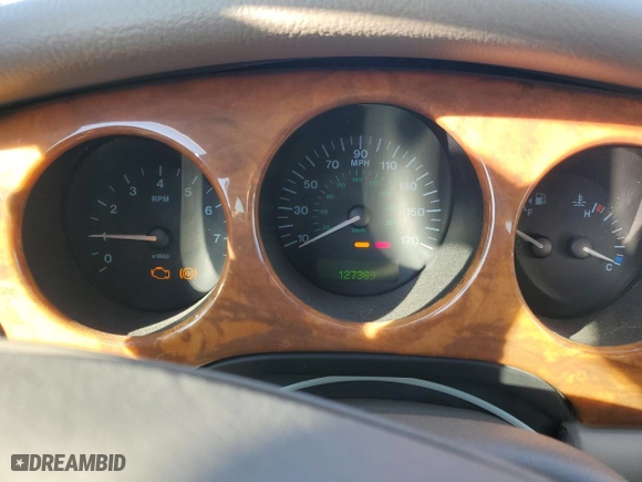 2001 Jaguar XJ with VIN SAJDA14CX1LF29825, listed as a Copart auction lot 42064715 with 127,389 mi miles and Salvage Title. Bid and sale history available at carsss.com. Image 9.