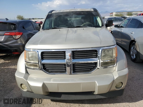 2009 Dodge Nitro SE z VIN 1D8GT28K29W504908, wystawiony jako Copart lot #75272154 z przebiegiem 156 571 mil mil oraz Szkoda całkowita • Salvage title. Historia ofert i sprzedaży dostępna na DreamBid. Obrazek 5.