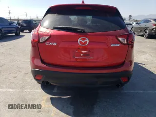 2014 Mazda CX-5 Touring with VIN JM3KE2CY9E0356050, listed as a Copart auction lot 65470674 with 70,400 mi miles and Salvage Title. Bid and sale history available at DreamBid. Image 6.