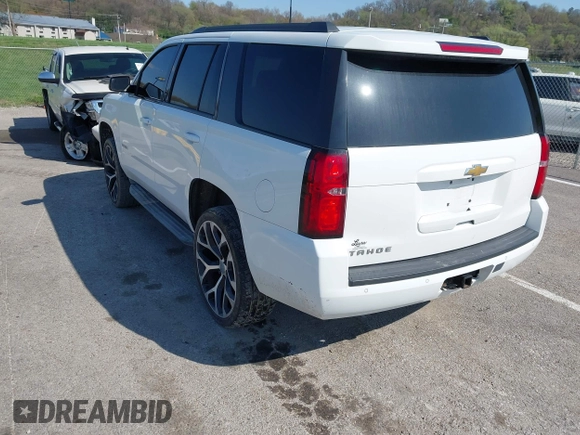 2015 Chevrolet Tahoe LT with VIN 1GNSCBKCXFR552071, listed as a IAAI auction lot 41972157 with 214,738 mi miles and . Bid and sale history available at DreamBid. Image 3.