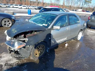 2006 Mitsubishi Lancer OZ-Rally with VIN JA3AJ86E56U000207, listed as a IAAI auction lot 41401698 with 239,219 mi miles. Bid and sale history available at carsss.com. Image 2.