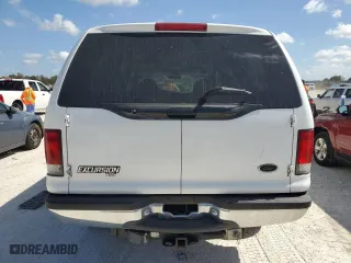 2000 Ford Excursion XLT with VIN 1FMSU41F0YEC90872, listed as a Copart auction lot 77243644 with 90,302 mi miles and Salvage Title. Bid and sale history available at carsss.com. Image 6.