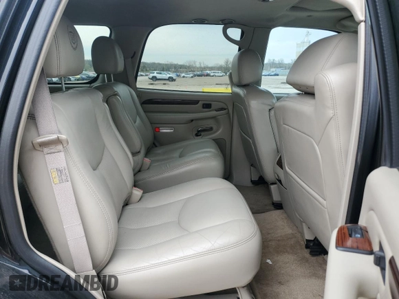 2003 Cadillac Escalade z VIN 1GYEK63N73R277166, wystawiony jako Copart lot #51797955 z przebiegiem 374 735 mil mil oraz Czysty tytuł • Clean title. Historia ofert i sprzedaży dostępna na DreamBid. Obrazek 11.