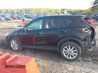 2015 Mazda CX-5 Grand Touring with VIN JM3KE4DY6F0513173, listed as a IAAI auction lot 41867030 with 93,770 mi miles. Bid and sale history available at carsss.com. Image 14.