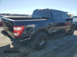2023 Ford F-150 XL with VIN 1FTFW1E55PKD59670, listed as a Copart auction lot 48297005 with 20,668 mi miles and Salvage Title. Bid and sale history available at carsss.com. Image 3.