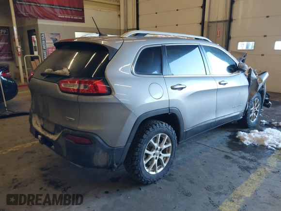 2015 Jeep Cherokee Latitude with VIN 1C4PJMCS5FW510298, listed as a IAAI auction lot 41518453 with 99,568 mi miles and . Bid and sale history available at DreamBid. Image 4.