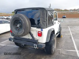 2001 Jeep Wrangler Sport with VIN 1J4FA49S41P308407, listed as a IAAI auction lot 41772240 with 139,461 mi miles. Bid and sale history available at carsss.com. Image 4.