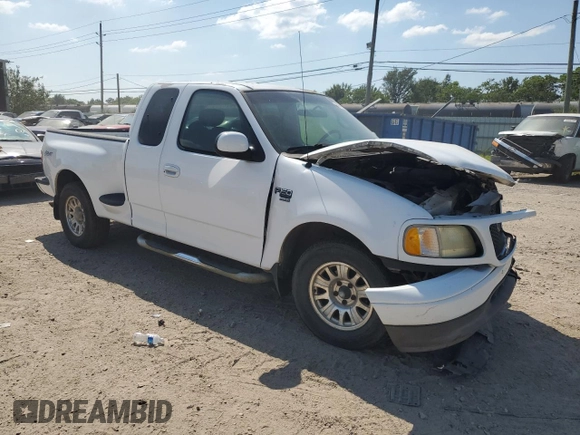 2002 Ford F-150 XL with VIN 1FTRX07W52KB08618, listed as a Copart auction lot 57941974 with 172,843 mi miles and Salvage title. Bid and sale history available at DreamBid. Image 4.