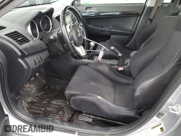 2014 Mitsubishi Lancer Evolution GSR z VIN JA32W8FVXEU000210, wystawiony jako Copart lot #87228694 z przebiegiem 120 356 mil mil oraz Szkody całkowita. Historia ofert i sprzedaży dostępna na DreamBid. Obrazek 7.