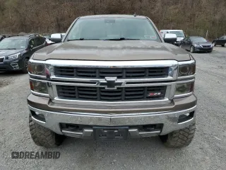 2014 Chevrolet Silverado 1500 LTZ with VIN 1GCVKSEC0EZ140325, listed as a Copart auction lot 52954845 with 128,231 mi miles and Salvage Title. Bid and sale history available at DreamBid. Image 5.