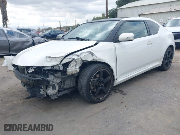2014 Scion tC with VIN JTKJF5C79E3075707, listed as a IAAI auction lot 41557310 with 132,468 mi miles. Bid and sale history available at carsss.com. Image 18.