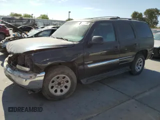 2001 GMC Yukon SLT with VIN 1GKEC13T31J198419, listed as a Copart auction lot 65012144 with 210,431 mi miles and Salvage Title. Bid and sale history available at carsss.com. Image 1.