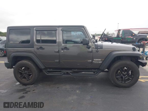 2018 Jeep Wrangler Unlimited Sport S with VIN 1C4BJWDG1JL810754, listed as a IAAI auction lot 42419199 with 74,901 mi miles and . Bid and sale history available at DreamBid. Image 13.