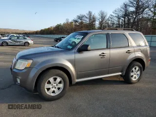 2010 Mercury Mariner z VIN 4M2CN9B70AKJ28137, wystawiony jako Copart lot #48926345 z przebiegiem 100 975 mil mil oraz Szkody całkowita. Historia ofert i sprzedaży dostępna na DreamBid. Obrazek 1.