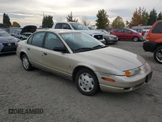 2001 Saturn SL z VIN 1G8ZH52831Z348124, wystawiony jako Copart lot #76058854 z przebiegiem 191 465 mil mil oraz Szkoda całkowita • Salvage title. Historia ofert i sprzedaży dostępna na DreamBid. Obrazek 4.
