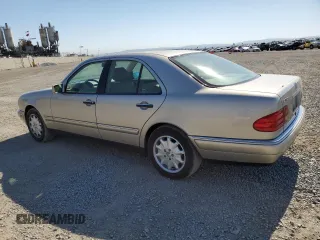 1999 Mercedes-Benz E-Class with VIN WDBJF65H5XA804902, listed as a Copart auction lot 73704634 with 92,411 mi miles and Salvage Title. Bid and sale history available at carsss.com. Image 2.