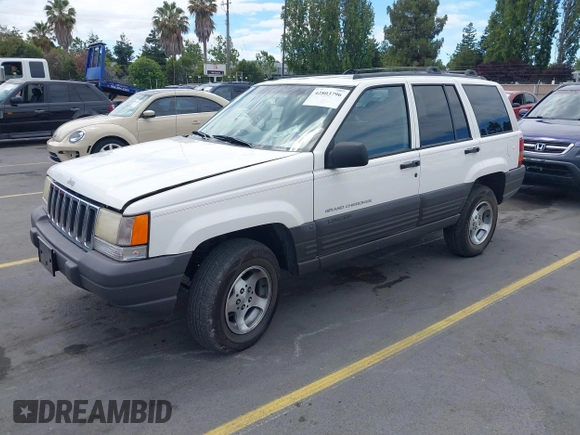 1996 Jeep Grand Cherokee Laredo with VIN 1J4FX58S5TC388512, listed as a IAAI auction lot 42803796 with 147,732 mi miles and . Bid and sale history available at DreamBid. Image 2.