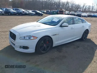 2015 Jaguar XJ with VIN SAJWA2EK9FMV87430, listed as a IAAI auction lot 41408797 with 101,147 mi miles and . Bid and sale history available at DreamBid. Image 2.