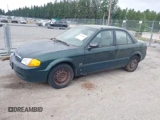 1999 Mazda Protege DX z VIN JM1BJ2222X0151674, wystawiony jako IAAI lot #42444584 z przebiegiem 219 862 mil mil oraz . Historia ofert i sprzedaży dostępna na DreamBid. Obrazek 2.