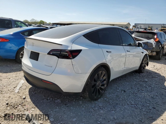 2021 Tesla Model Y Performance with VIN 5YJYGDEF7MF269221, listed as a Copart auction lot 52109785 with 61,619 mi miles and Salvage Title. Bid and sale history available at DreamBid. Image 3.