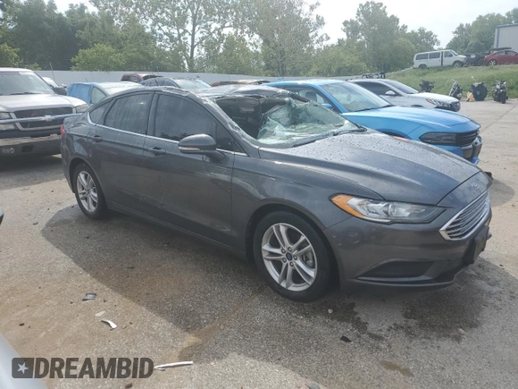 2018 Ford Fusion SE z VIN 3FA6P0H78JR261102, wystawiony jako Copart lot #69963883 z przebiegiem 120 068 mil mil oraz Czysty tytuł • Clean title. Historia ofert i sprzedaży dostępna na DreamBid. Obrazek 4.