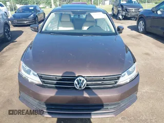2015 Volkswagen Jetta Sport z VIN 3VWD17AJ5FM411217, wystawiony jako IAAI lot #42563776 z przebiegiem 84 520 mil mil oraz . Historia ofert i sprzedaży dostępna na DreamBid. Obrazek 12.