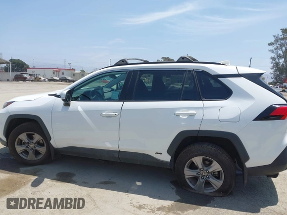 2022 Toyota RAV4 Hybrid XLE with VIN 2T3RWRFV9NW130472, listed as a IAAI auction lot 40990707 with 156,174 mi miles and . Bid and sale history available at DreamBid. Image 14.