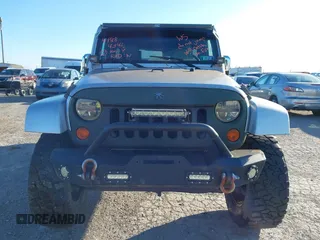 2010 Jeep Wrangler Unlimited Sahara with VIN 1J4BA5H14AL230604, listed as a IAAI auction lot 41884346 with 97,060 mi miles. Bid and sale history available at carsss.com. Image 6.