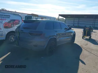 2021 Jeep Grand Cherokee Laredo E with VIN 1C4RJEAG3MC713511, listed as a IAAI auction lot 41235904 with 73,343 mi miles and . Bid and sale history available at DreamBid. Image 4.