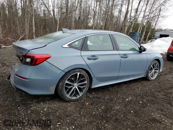 2023 Honda Civic Touring z VIN 2HGFE1F93PH002825, wystawiony jako Copart lot #52773065 z przebiegiem 20 659 mil mil oraz Szkoda całkowita • Salvage title. Historia ofert i sprzedaży dostępna na DreamBid. Obrazek 3.