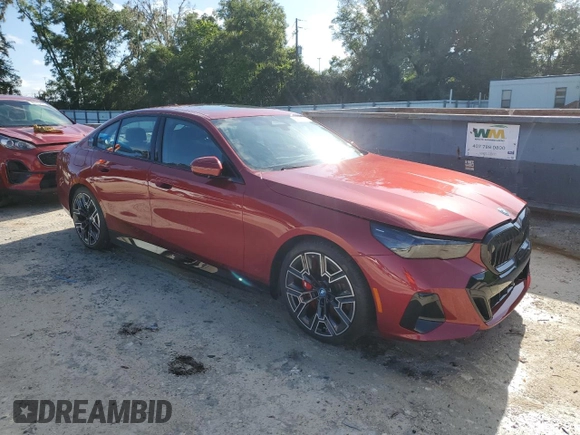 2024 BMW i5 eDrive40 with VIN WBY33FK01RCR76500, listed as a Copart auction lot 65026585 with 3,601 mi miles and Salvage title. Bid and sale history available at DreamBid. Image 4.