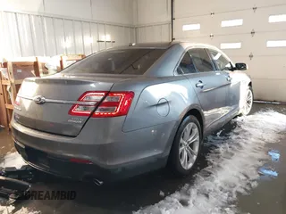 2013 Ford Taurus SEL z VIN 1FAHP2E89DG150197, wystawiony jako IAAI lot #41214999 z przebiegiem 146 307 mil mil oraz . Historia ofert i sprzedaży dostępna na DreamBid. Obrazek 4.