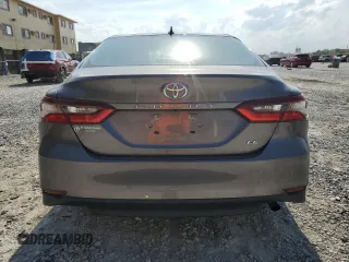 2023 Toyota Camry LE z VIN 4T1C11AK5PU757393, wystawiony jako Copart lot #57822715 z przebiegiem 26 616 mil mil oraz Czysty tytuł • Clean title. Historia ofert i sprzedaży dostępna na DreamBid. Obrazek 6.