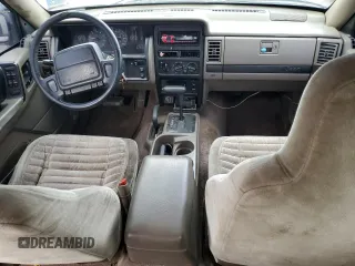 1995 Jeep Grand Cherokee Laredo with VIN 1J4GZ58S2SC703196, listed as a Copart auction lot 68571944 with 264,876 mi miles and Clean Title. Bid and sale history available at carsss.com. Image 8.