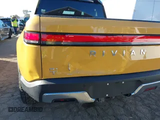 2022 Rivian R1T Adventure Package with VIN 7FCTGAAA2NN005811, listed as a IAAI auction lot 41706558 with 21,336 mi miles. Bid and sale history available at carsss.com. Image 6.