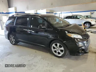 2014 Toyota Sienna SE with VIN 5TDXK3DC5ES418508, listed as a Copart auction lot 69742974 with 210,168 mi miles and Salvage Title. Bid and sale history available at DreamBid. Image 4.