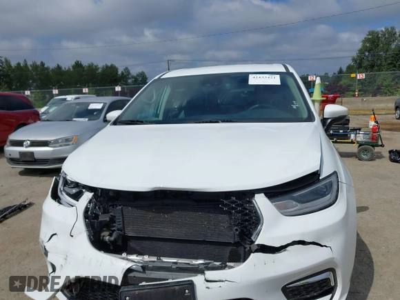 2023 Chrysler Pacifica Hybrid Touring L with VIN 2C4RC1L77PR541513, listed as a IAAI auction lot 42433421 with 53,979 mi miles and . Bid and sale history available at DreamBid. Image 13.