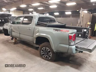 2023 Toyota Tacoma 4WD SR with VIN 3TMCZ5ANXPM607489, listed as a IAAI auction lot 41605018 with 15,229 mi miles. Bid and sale history available at carsss.com. Image 3.