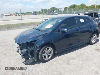 2019 Toyota Corolla Hatchback SE with VIN JTNK4RBE3K3061589, listed as a IAAI auction lot 42123273 with 90,491 mi miles. Bid and sale history available at carsss.com. Image 2.